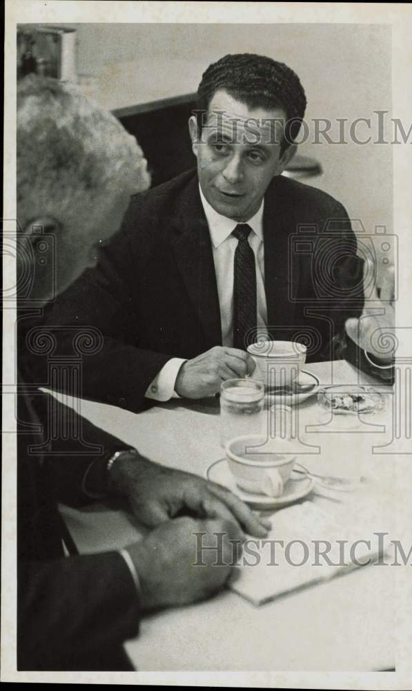 1958 Press Photo Gino Negretti, lawyer for Cubans involved in firearms cache.- Historic Images