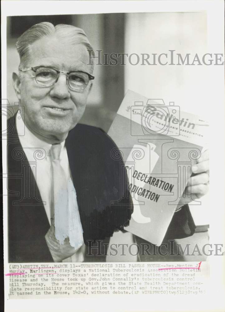 1965 Press Photo Representative Menton Murray holds National Tuberculosis book.- Historic Images