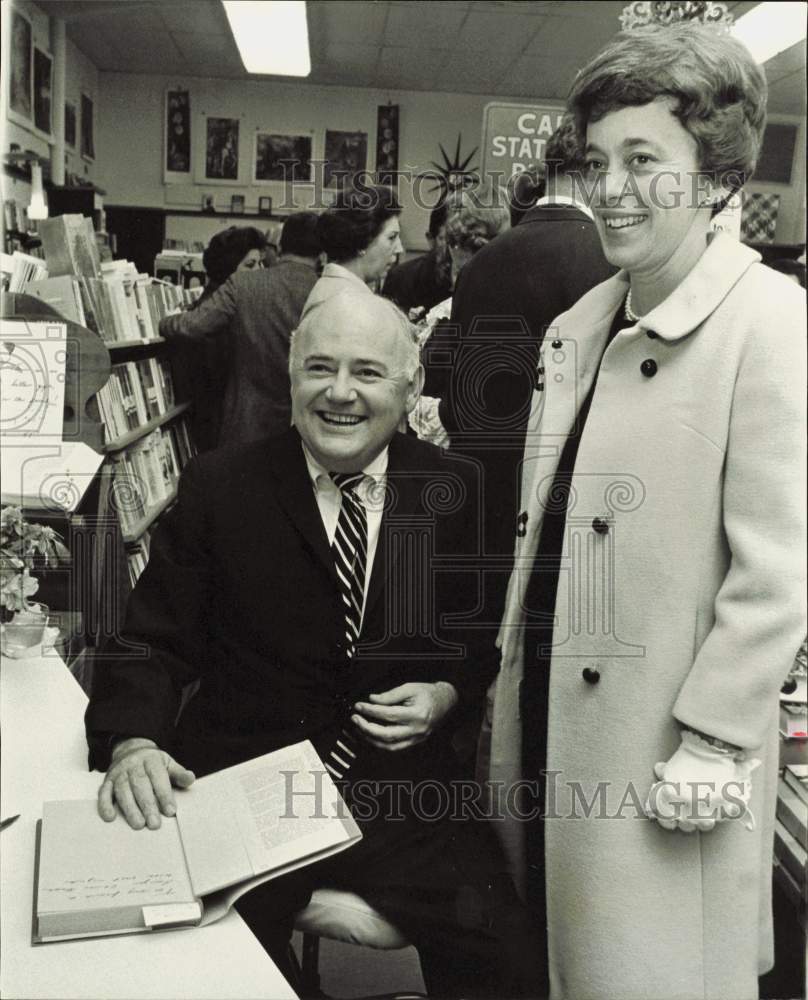 1968 Press Photo Frank Oltorf, author, autographs book for Mrs. Joseph Brown.- Historic Images