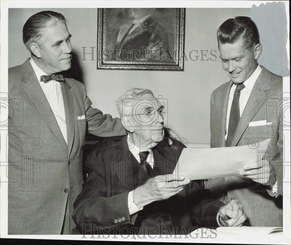 1954 Press Photo Judge T.M. Kennerly congratulates grandson Oscar Kennerly.- Historic Images