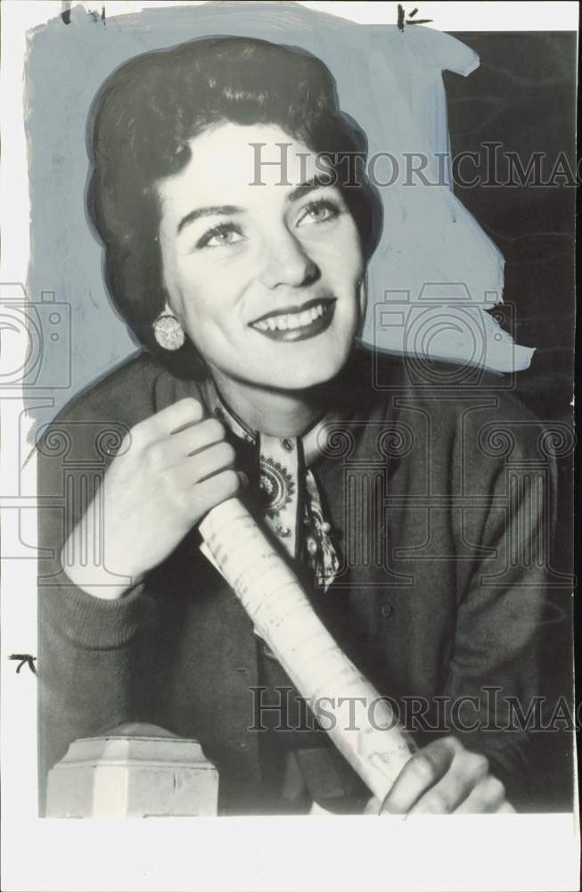 1955 Press Photo Jeannette Miller, singer, holds her Paramount Studio contract.- Historic Images