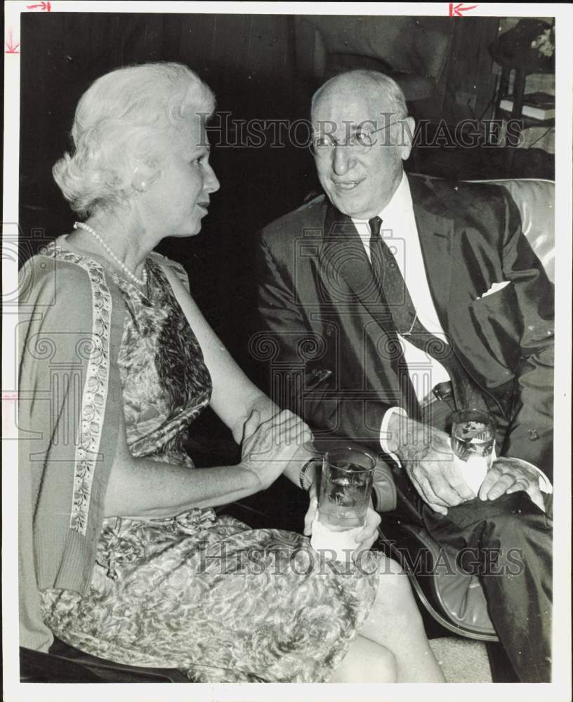 1965 Press Photo Mrs. Frank Isenhart chats with John Shea at R.R. Deans&#39; party.- Historic Images