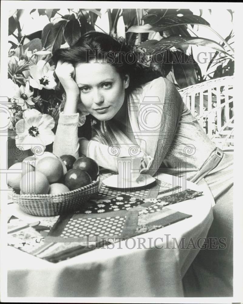 Press Photo Woman Posing at Table with Tea &amp; Fruit - hpa89061- Historic Images