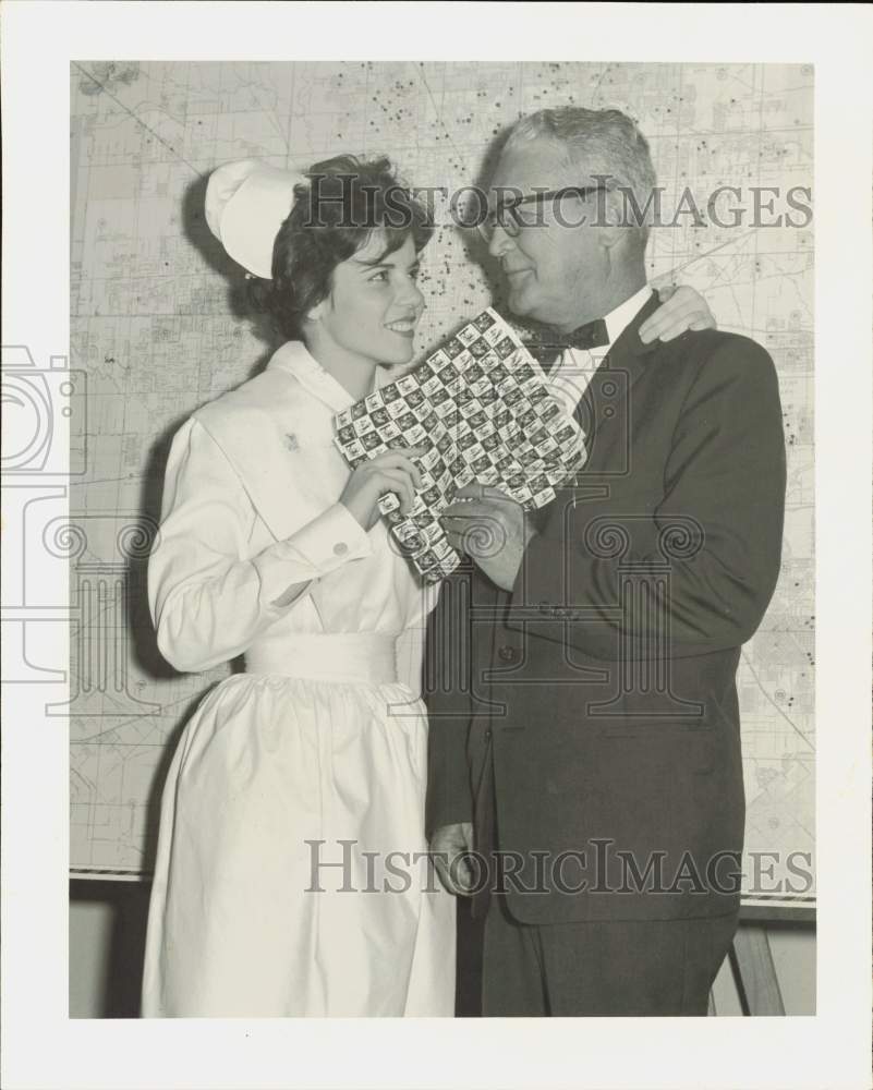 1961 Press Photo Gloria Poole Presents Christmas Seals to Dr. J.C. McGuire- Historic Images