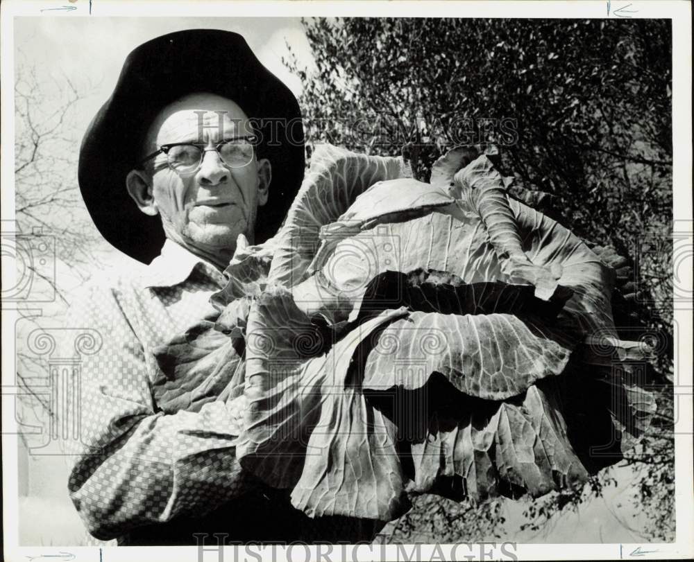 1974 Press Photo John Warnasch Holding 14 Pound Cabbage - hpa89864- Historic Images