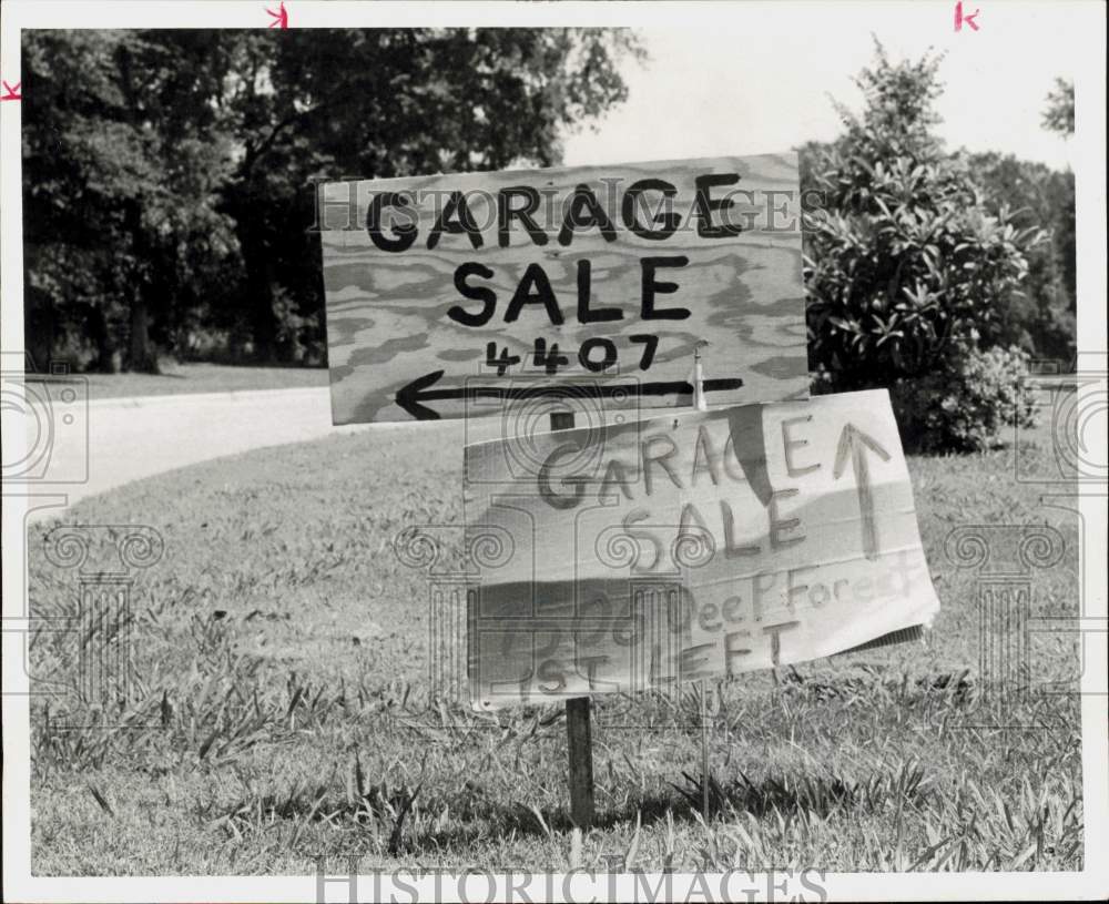 1972 Press Photo Garage sale signs indicate different directions. - hpa90845- Historic Images