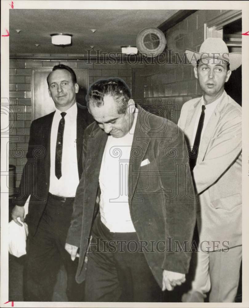 1967 Press Photo Ray Flores in custody of detectives at police station.- Historic Images