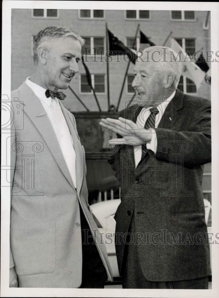 1957 Press Photo Paul Koonce and Elwell discuss airport problems. - hpa91831- Historic Images