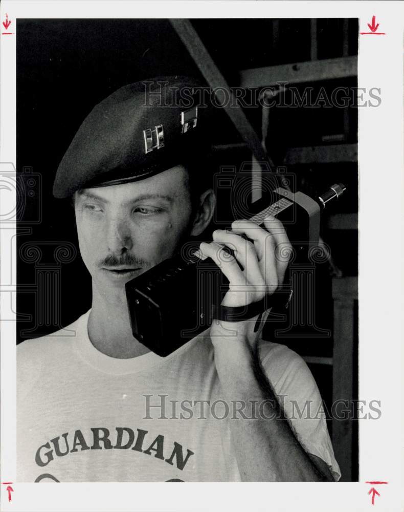 1984 Press Photo Guardian Angel Mike Porterfield uses a walkie-talkie.- Historic Images