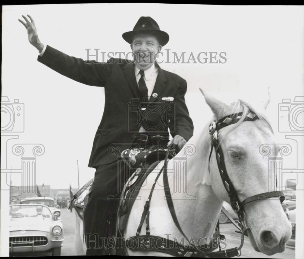 1957 Press Photo Francis Law of First City National Bank, TX, waves from horse- Historic Images