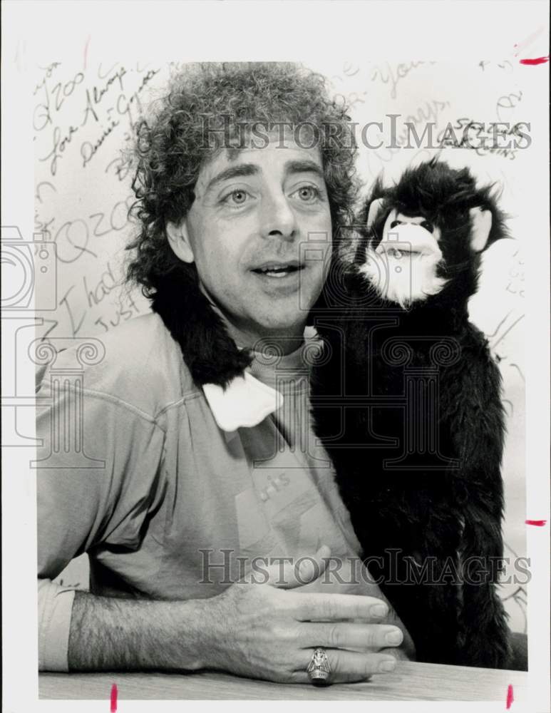 1986 Press Photo Houston DJ John Lander poses with KKBQ radio prop - hpa92584- Historic Images