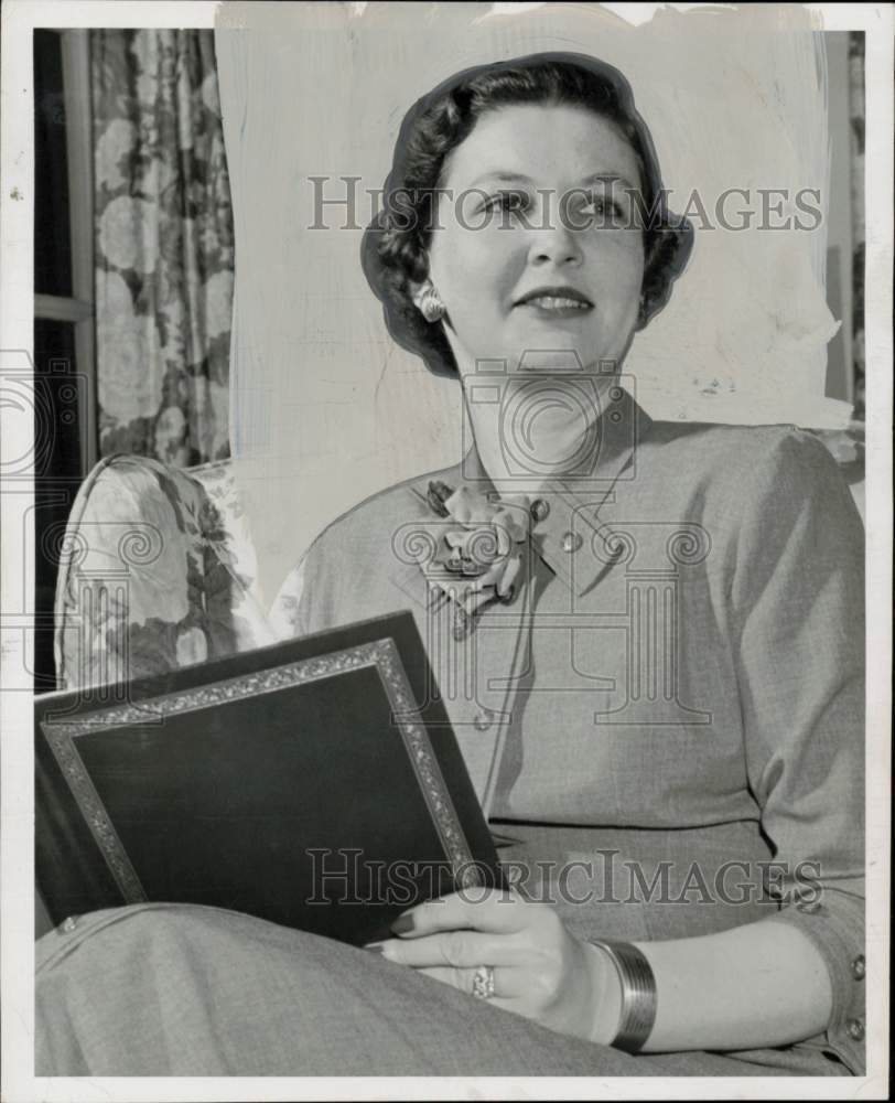 1956 Press Photo Mrs. Louis Letzerich, banker&#39;s wife, holds album - hpa92729- Historic Images