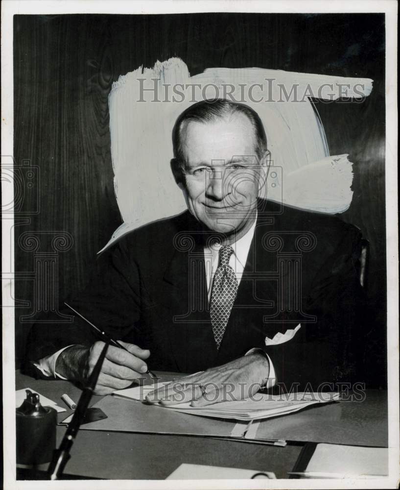 1956 Press Photo Harry E. Rogers, Hughes Tool vice president, works at his desk.- Historic Images