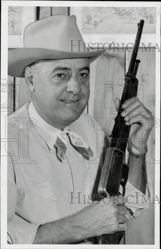 1956 Press Photo Reese Lockett, Mayor of Brenham, holds rifle. - hpa93161- Historic Images