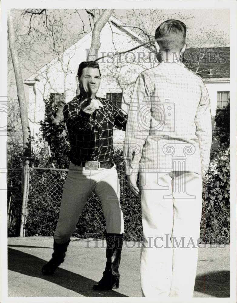 1961 Press Photo Rusty Ryan, bullwhip artist, performs his art. - hpa93342- Historic Images