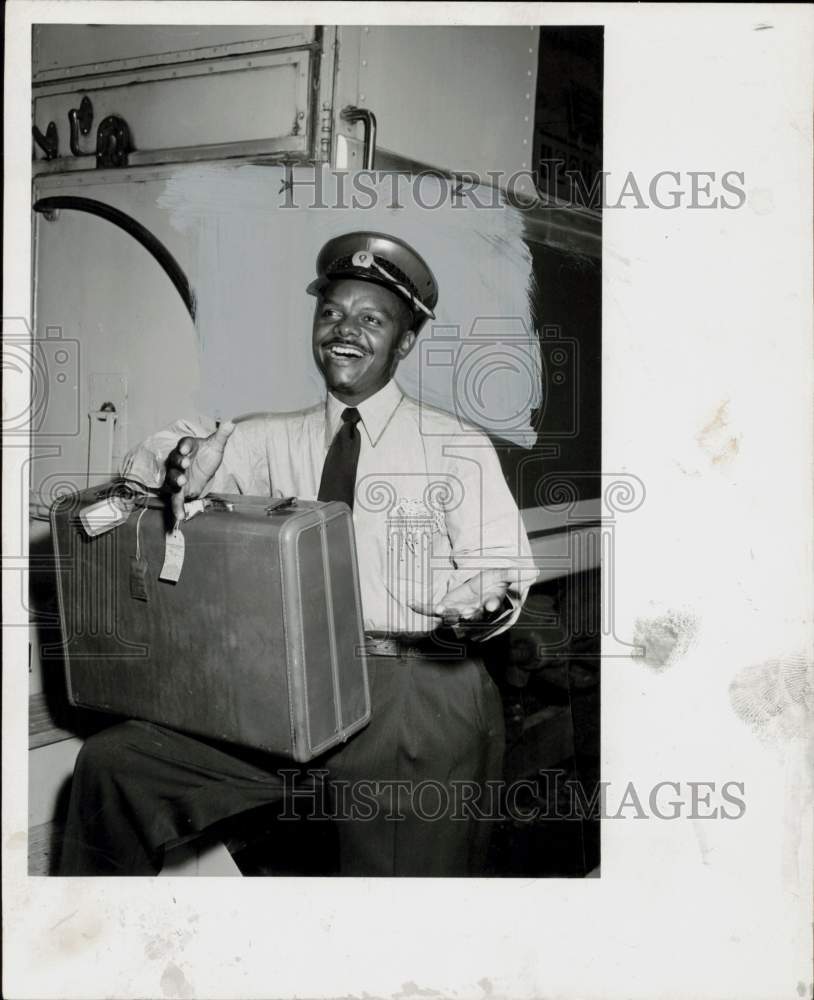 1957 Press Photo Jack A. York, TV singer, stands with his suitcase. - hpa93370- Historic Images