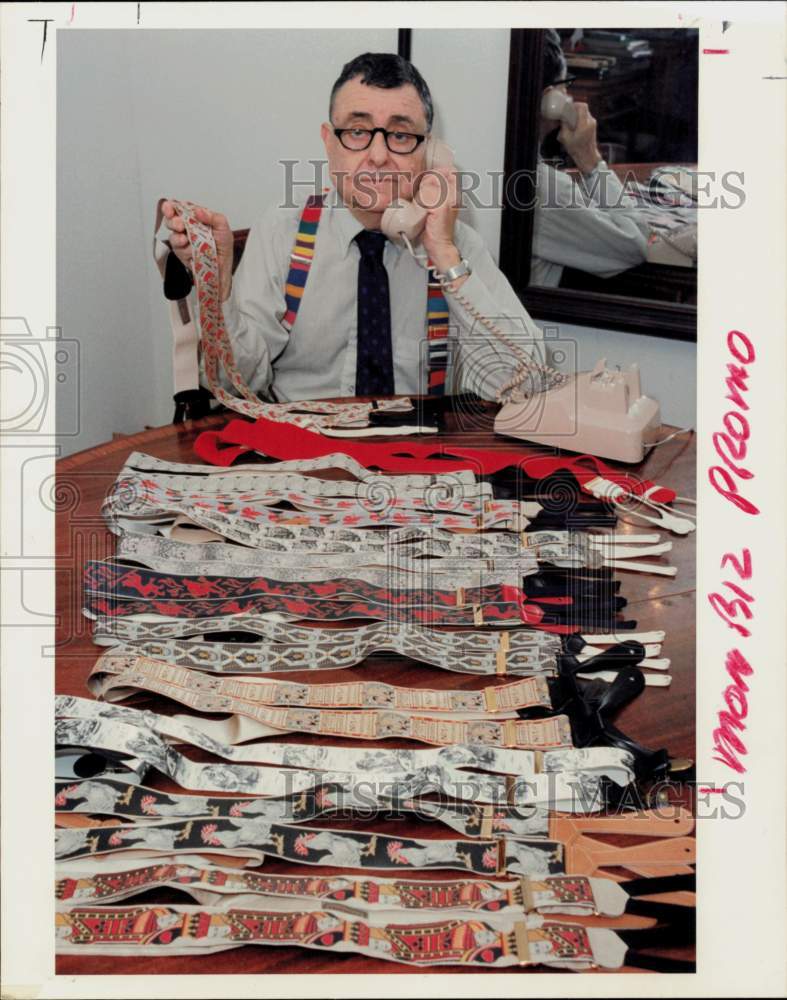 1988 Press Photo Bernard Moses sells suspenders from his apartment. - hpa93572- Historic Images