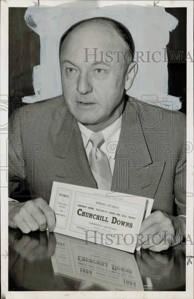 1955 Press Photo Jack Pollard holds Churchill Downs Spring Stakes information.- Historic Images