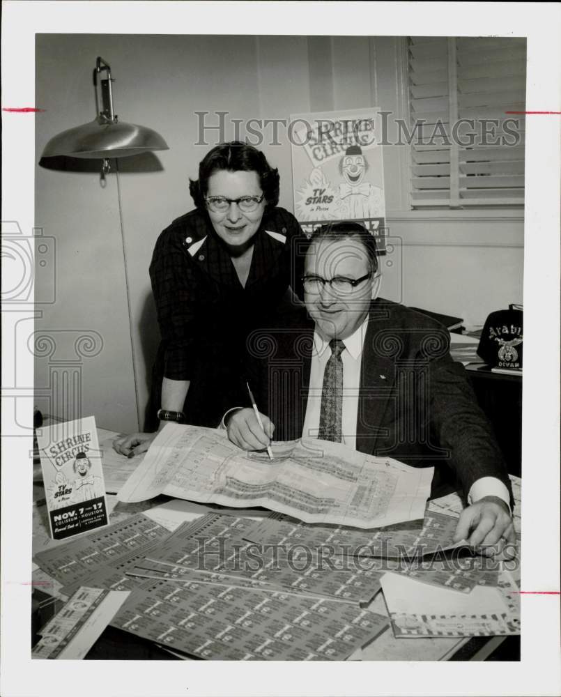 1957 Press Photo Mr. and Mrs. Howard Phifer work in Shrine Circus headquarters.- Historic Images