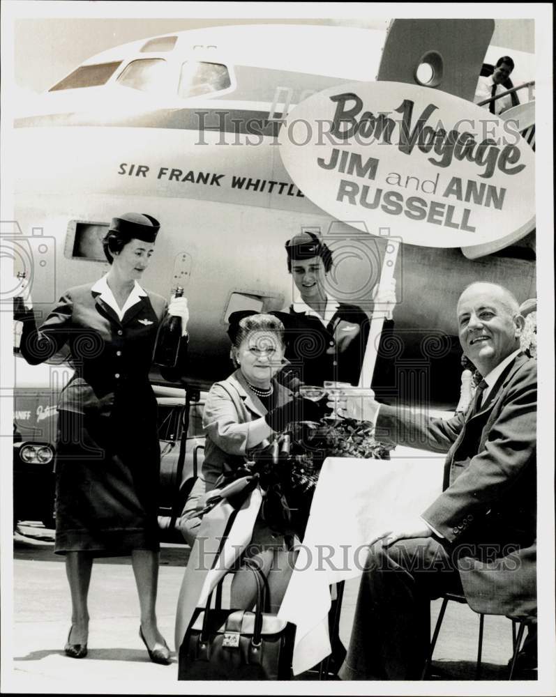 1962 Press Photo Mr. and Mrs. J.E. Russell hold Bon Voyage sign at airport, TX- Historic Images