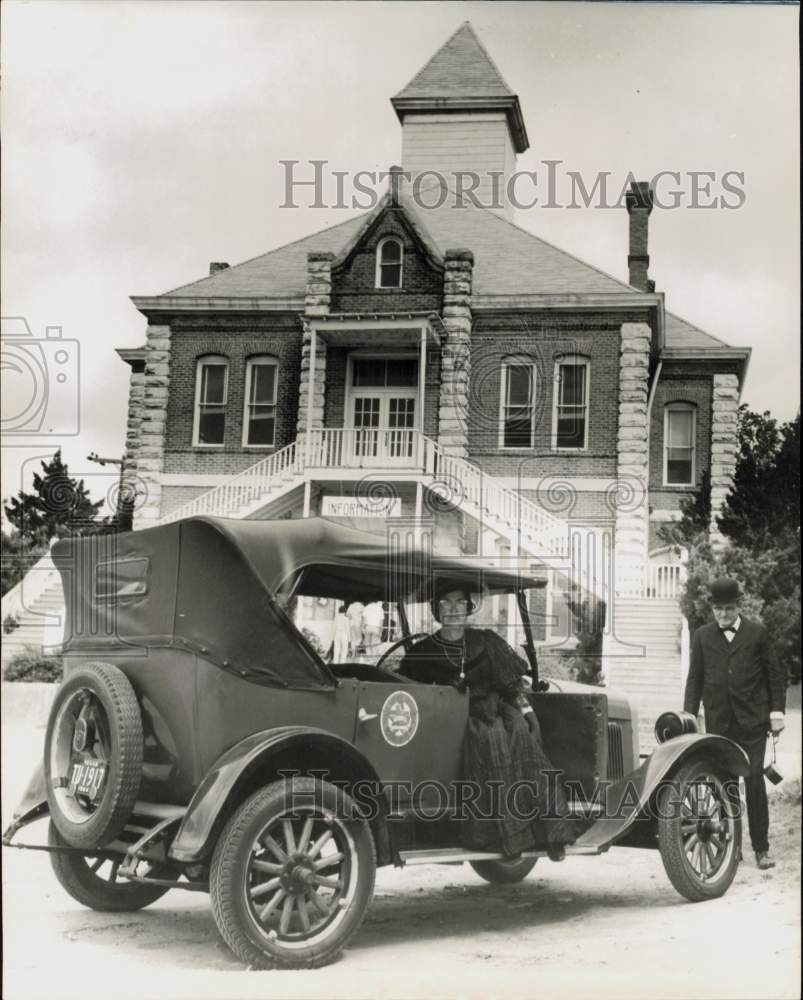 1964 Press Photo Mrs. O.K. Pyle in 1926 car poses at Grimes County Courthouse.- Historic Images