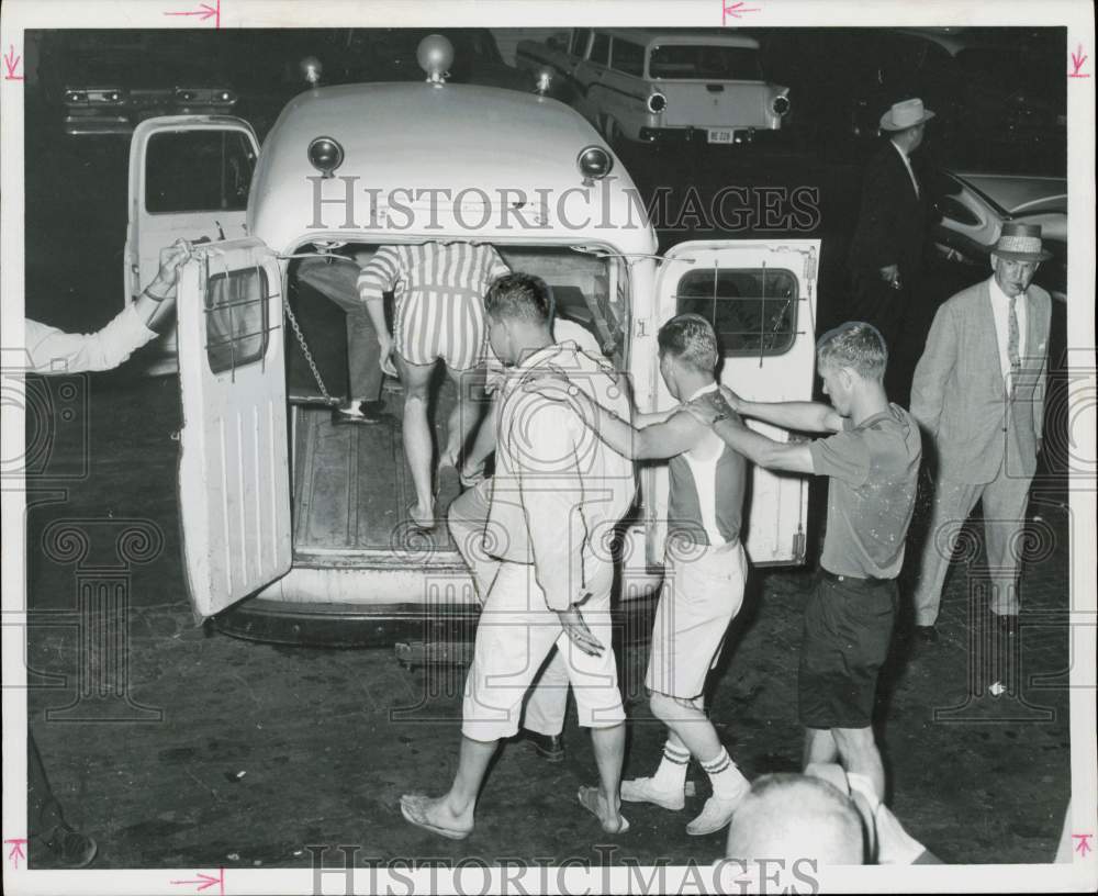 1961 Press Photo Galveston Splash Day participants loaded in police van.- Historic Images