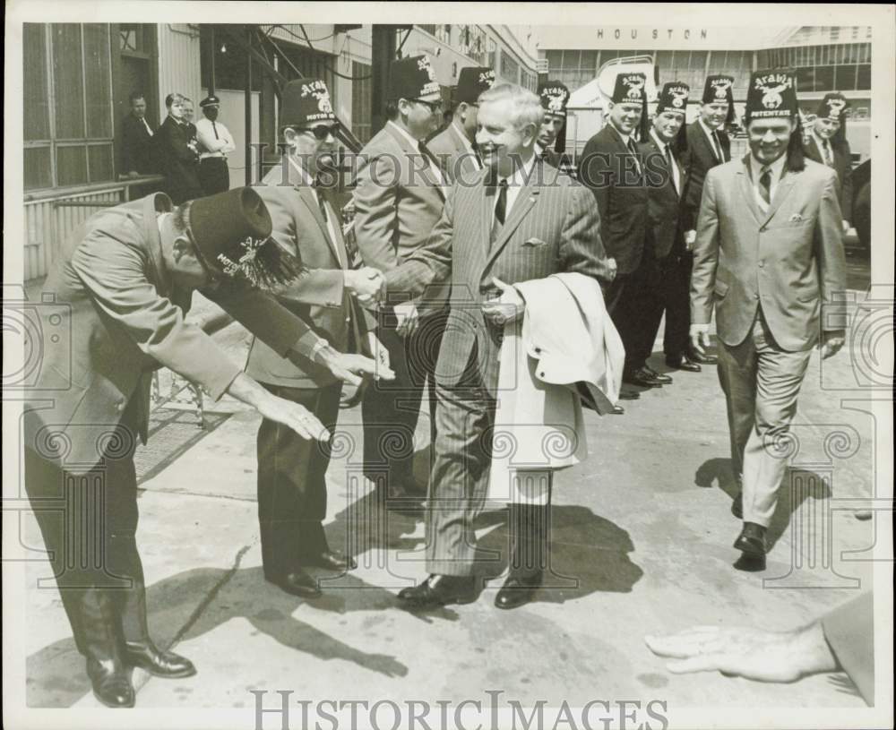 1967 Press Photo Deputy Imperial Potentate Orville Rush greeted in Houston.- Historic Images