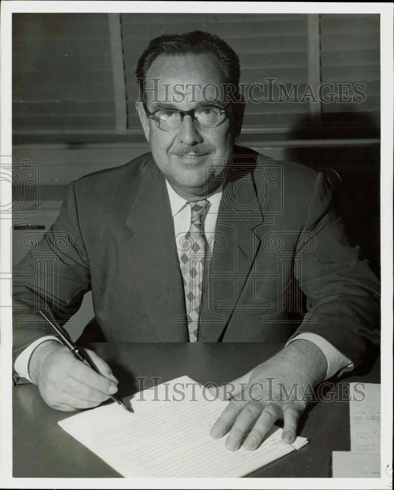 1955 Press Photo Ward P. Kessler, Aluminum Products President, works at desk.- Historic Images