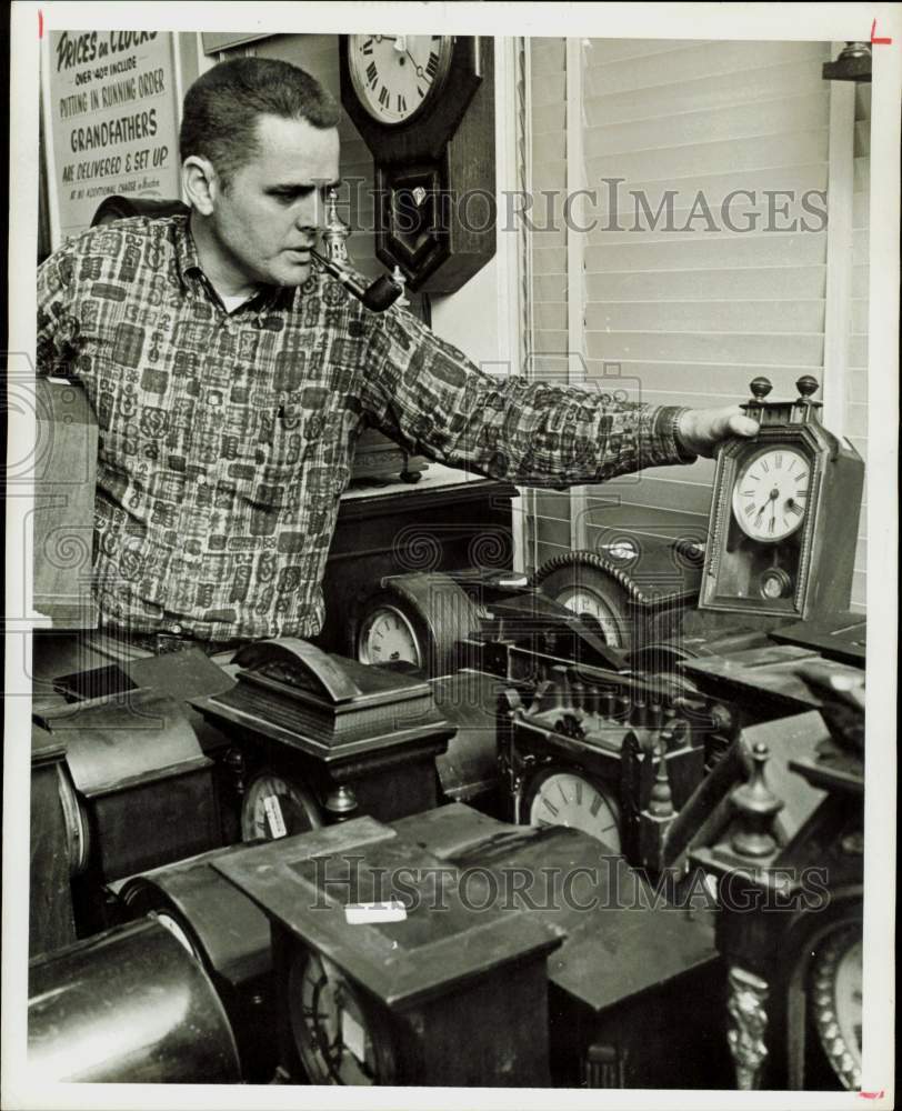 1969 Press Photo Chappell Jordan of Houston Antiques Dealers displays clocks.- Historic Images