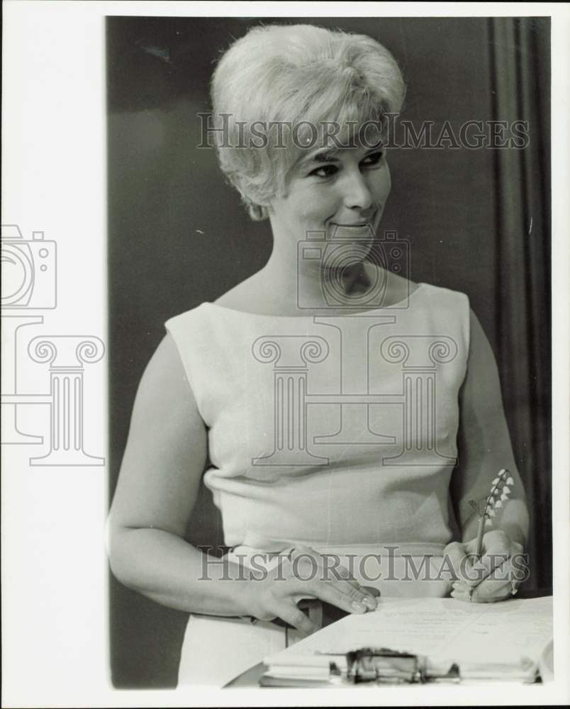 1965 Press Photo Marge Johnson, KRRC-TV producer, signs papers - hpa98679- Historic Images