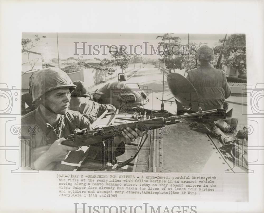 1965 Press Photo Marines patrol Santo Domingo from armored vehicle. - hpm00955