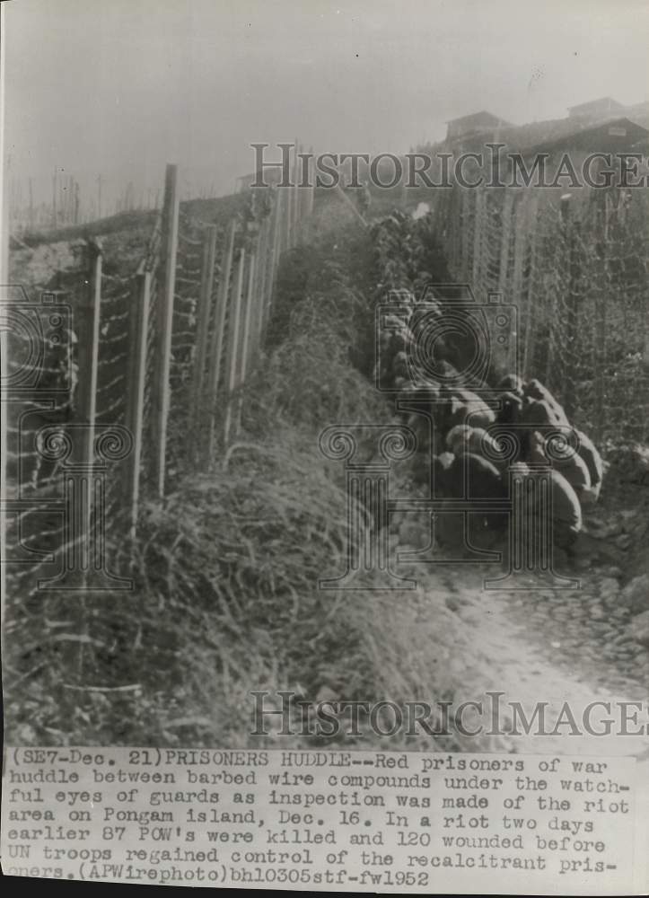 1952 Press Photo Red Prisoners of War Huddle in Barbed Wire Compounds, Korea- Historic Images