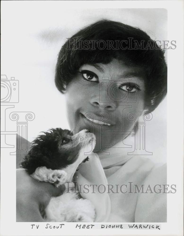 Press Photo Dionne Warwick, singer, holding a puppy - hpp12240- Historic Images