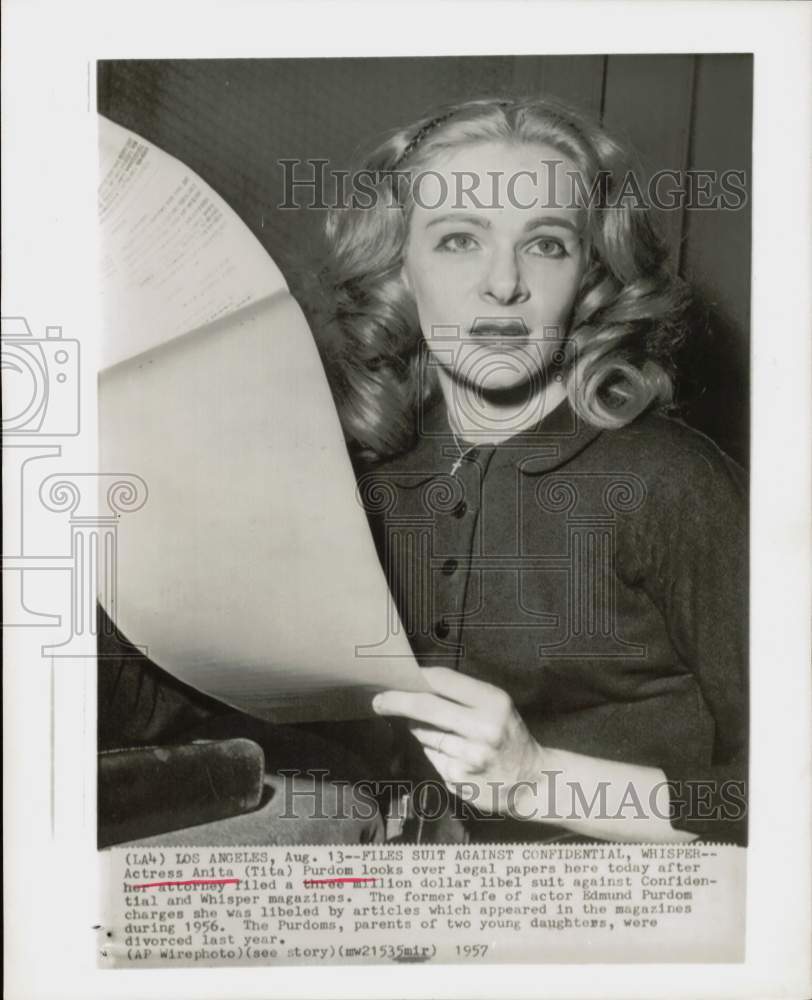 1957 Press Photo Anita Purdom holds legal papers in Los Angeles lawyer&#39;s office.- Historic Images