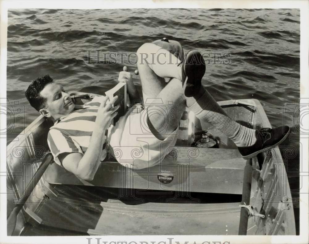 1959 Press Photo Panelist Henry Morgan Reading in Boat at Cape Cod - hpp31423- Historic Images