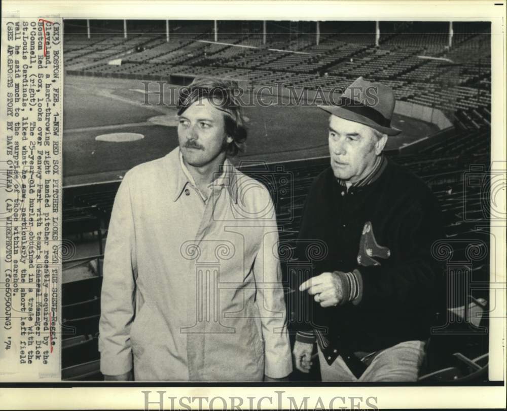 1974 Press Photo Reggie Cleveland and Dick O&#39;Connell look over Fenway Park.- Historic Images