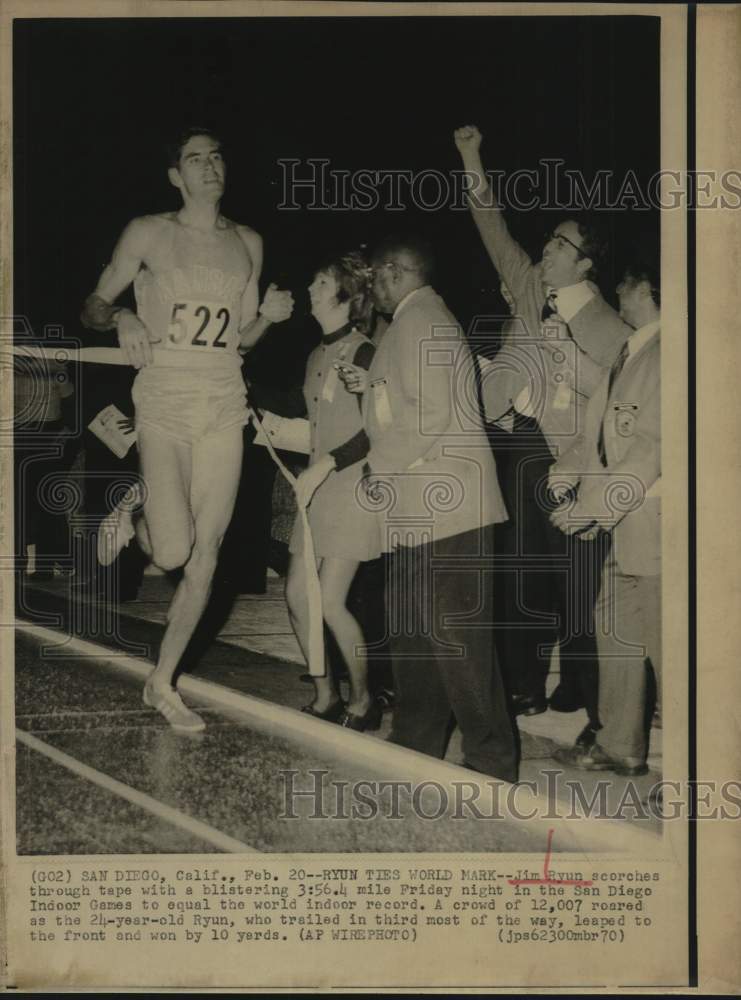 1970 Press Photo Jim Ryun crosses finish line at San Diego Indoor Games.- Historic Images