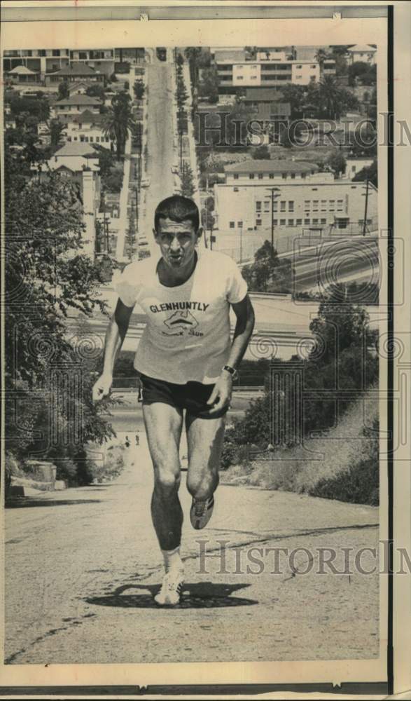 1965 Press Photo Ron Clarke, track star, runs uphill - hps02174- Historic Images