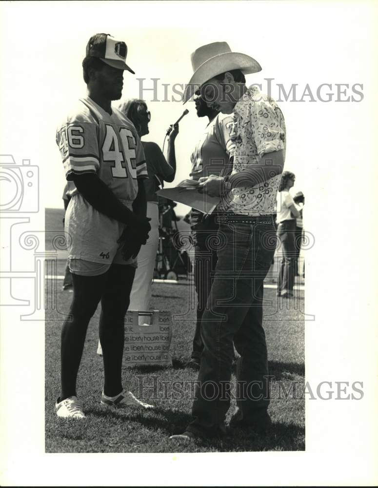 Press Photo Tim Campbell, football player, interviewed by the Press. - hps02263- Historic Images