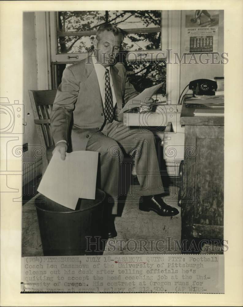 1958 Press Photo Len Casanova cleans out desk at University of Pittsburgh.- Historic Images