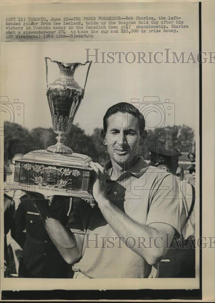 1968 Press Photo Golfer Bob Charles holds Seagram Gold Cup in Toronto.- Historic Images