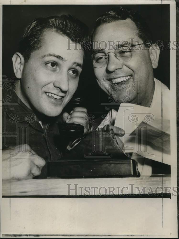 1958 Press Photo Football players Giles Miller and Connell Miller talk on phone- Historic Images