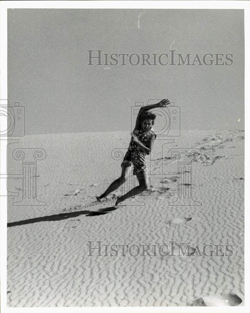 1975 Press Photo Child plays in Sand on Beach in Texas - hps10468- Historic Images