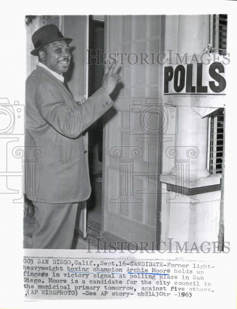 1963 Press Photo Boxer Archie Moore at San Diego polling station. - hps10631- Historic Images
