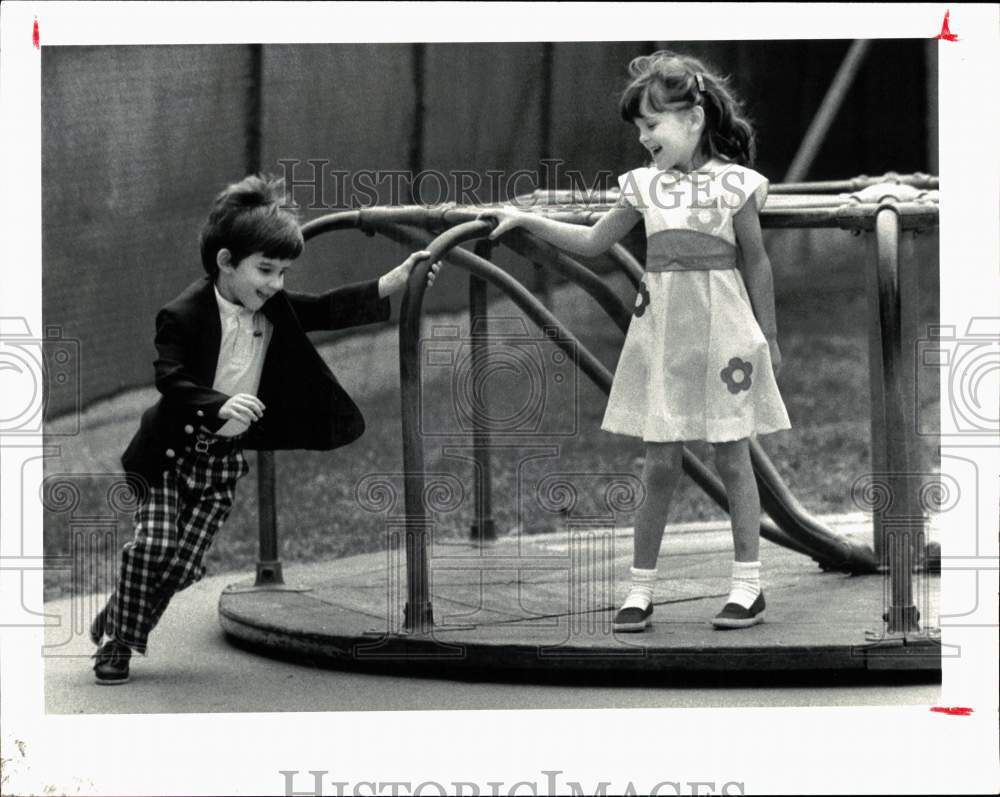 1983 Press Photo Children play on Merry-Go-Round - hps11256- Historic Images