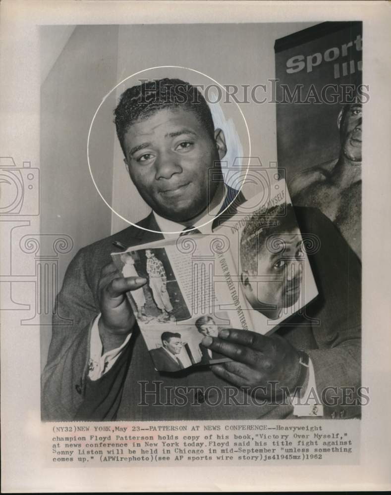 1962 Press Photo Boxer Floyd Patterson Poses with His Book, New York - hps13075- Historic Images