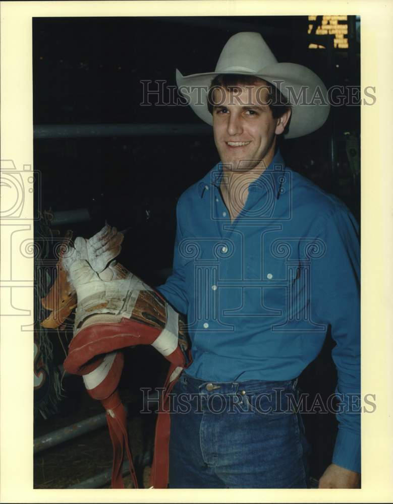 1990 Press Photo Rodeo Cowboy Wayne Herman with Saddle at Astrodome - hps20368- Historic Images