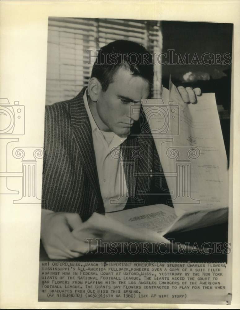 1960 Press Photo Football Player Charles Flowers Reads Lawsuit, Oxford, MS- Historic Images