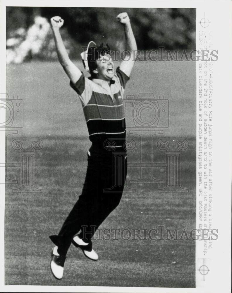 1987 Press Photo Larry Mize leaps after winning 51st Masters Championship in GA.- Historic Images