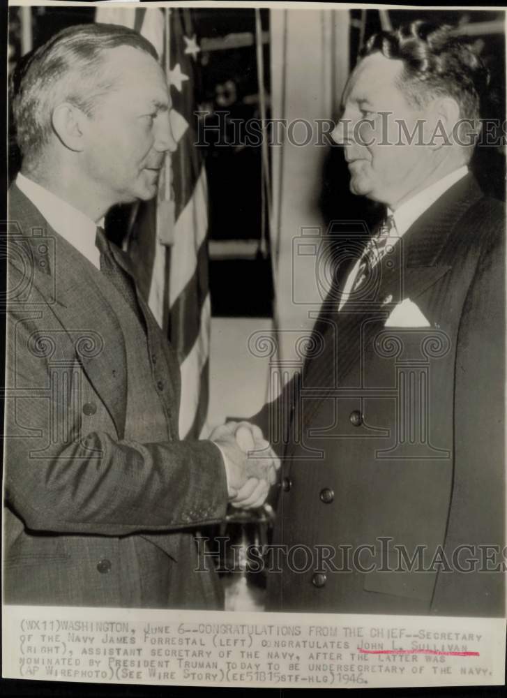 1946 Press Photo James Forrestal congratulates John Sullivan in Washington.- Historic Images